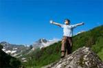 child on a mountain displaying confidence